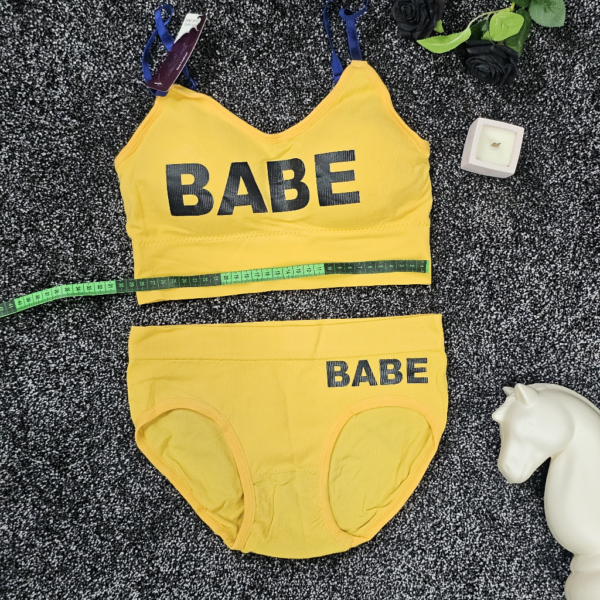 ست لباس زیر ورزشی و اسپرت زنانه نیم تنه زرد با شورت اسلیپ طرح BABE