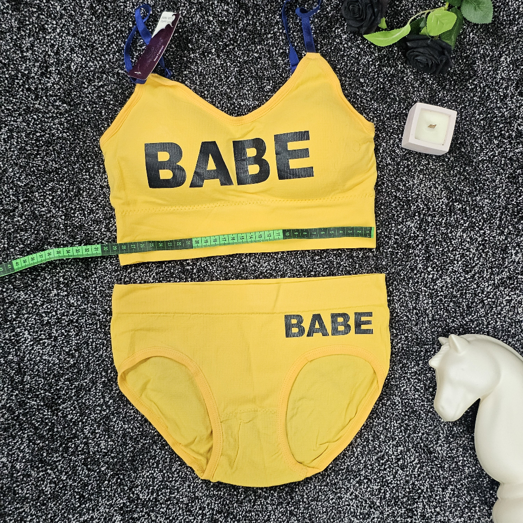 ست لباس زیر ورزشی و اسپرت زنانه نیم تنه زرد با شورت اسلیپ طرح BABE